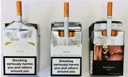  ??  ?? Evolution of Marlboro boxes, with an example of plain packaging on the right. Photograph: University of Bath