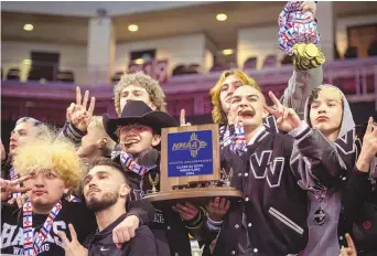  ?? CHANCEY BUSH/JOURNAL ?? Volcano Vista wrestlers celebrate after winning the 5A boys state team title on Saturday at the Rio Rancho Events Center In Rio Rancho.