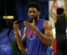  ?? CHRIS SZAGOLA — THE ASSOCIATED PRESS ?? Center Joel Embiid will be a spectator once again when the 76ers take on the Miami Heat Monday night in Game 2 of the NBA Eastern conference playoff series. Embiid was ruled out by head coach Brett Brown Sunday. The 76ers lead the series, 1-0.