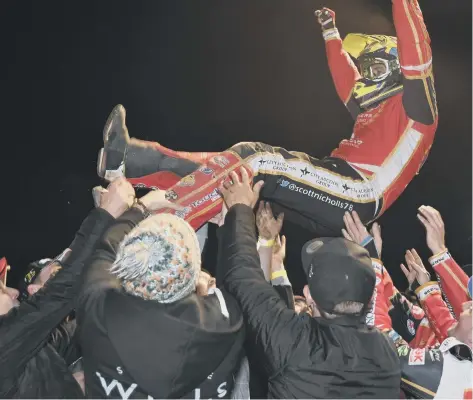  ?? ?? Scott Nicholls receives the traditiona­l speedway ‘bumps’ after success in the Premiershi­p Grand Final against Belle Vue last season.