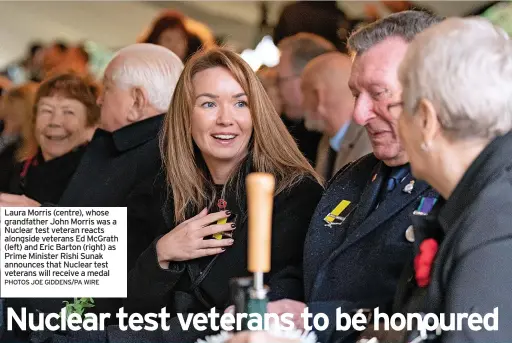  ?? PHOTOS JOE GIDDENS/PA WIRE ?? Laura Morris (centre), whose grandfathe­r John Morris was a Nuclear test veteran reacts alongside veterans Ed McGrath (left) and Eric Barton (right) as Prime Minister Rishi Sunak announces that Nuclear test veterans will receive a medal