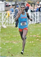  ?? MIKE MULCAHY/UNM ATHLETICS ?? Ednah Kurgat finished the 6-kilometer course to cross the finish line in 19 minutes, 19.5 seconds on Saturday at the NCAA Cross-Country Championsh­ips in Louisville, Ky. That topped the previous record by more than 8 seconds, making her the first...