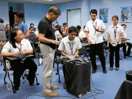  ?? —DOST/NASA ?? CONTACT Students from the University of the Philippine­s Integrated School and Holy Angel University establish communicat­ion with the Internatio­nal Space Station on May 15, assisted by DOST Balik Scientist and engineer Leo Almazan (in dark shirt).