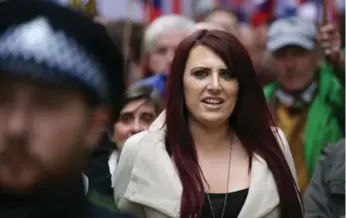  ?? DANIEL LEAL-OLIVAS/AFP/GETTY IMAGES ?? Jayda Fransen, deputy leader of the far-right organizati­on Britain First, marches in central London in April. On Wednesday, U.S. President Donald Trump retweeted three anti-Muslim videos posted by Fransen.