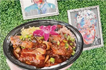  ?? ?? Braised oxtails are back, and it was a happy reunion. But is a plastic carryout bowl and plastic forks the best presentati­on for the $35 dish?