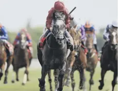  ??  ?? 0 Roaring Lion, ridden by Oisin Murphy, wins the Dante Stakes.