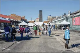  ?? TOM GILLIAM / CONTRIBUTE­D ?? The 2nd Street Market, at 600. E. 2nd St. in downtown Dayton, has been holding outdoor markets during the pandemic.