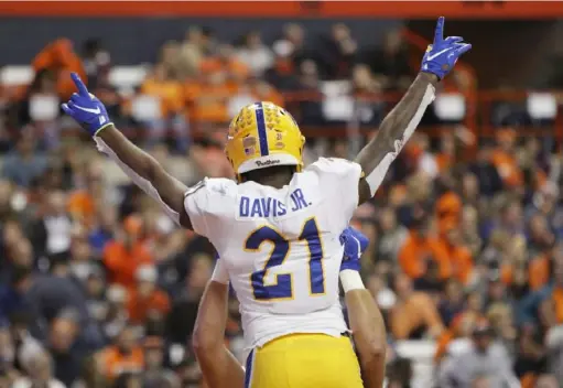  ?? Associated Press ?? A.J. Davis celebrates after scoring a touchdown in the second quarter against Syracuse. Davis finished with 16 carries for 103 yards.