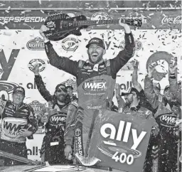  ?? GEORGE WALKER IV/AP ?? Ross Chastain holds a guitar presented to him after winning the Ally 400 on Sunday in Lebanon, Tenn.