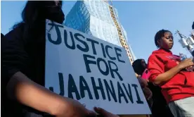  ?? On Thursday in Seattle. Photograph: Lindsey Wasson/AP ?? A protester holds a sign calling for justice after the death of 23-year-old Jaahnavi Kandula,