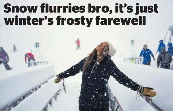  ?? Photo / Jill Tester ?? Christine Law enjoys the snow falling on Coronet Peak.