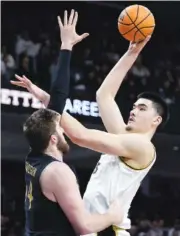  ?? AP PHOTO/NAM Y. HUH ?? Purdue center Zach Edey, right, shoots over Northweste­rn center Matthew Nicholson during the first half of a Big Ten game Sunday in Evanston, Ill.