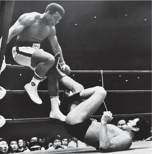  ?? — AP FILES ?? On July 26, 1976, world boxing champion Muhammad Ali was evading kicks by wrestler Antonio Inoki during a 15-round bout in Tokyo, considered a ‘farce’ at the time. The matchup was a forerunner of the Floyd Mayweather-Conor McGregor fight set for...
