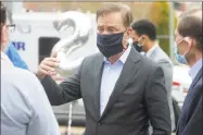  ?? Ned Gerard / Hearst Connecticu­t Media ?? Gov. Ned Lamont wants state resident to remain vigilant in the coronaviru­s crisis, and wear masks in public while keeping social distances of at least six feet from others.