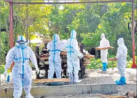  ?? ANI ?? People perform the last rites of a Covid-19 victim at a cremation ground in Sonitpur, Assam.