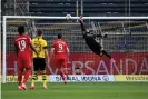  ??  ?? Dortmund’s Swiss goalkeeper Roman Bürki fails to keep out Joshua Kimmich’s delicious chipped finish. Photograph: Federico Gambarini/AFP/Getty Images