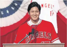  ??  ?? Shohei Ohtani speaks during his introducti­on at Angel Stadium.