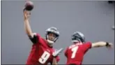  ?? ERIN GRUGAN — THE PRESS OF ATLANTIC CITY VIA AP ?? Eagles QBs Nick Foles (9) and Nate Sudfeld throw during practice at the team’s training facility in Philadelph­ia on Thursday.