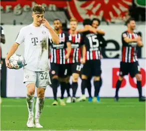  ??  ?? Drubbing: bayern munich’s Joshua Kimmich looks dejected after eintracht Frankfurt scored their fifth goal against them last week. — reuters