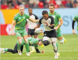  ?? Picture: TRYSPORTIM­AGES ?? Napolioni Bolaca runs away to score against Ireland at the Vancouver 7s last weekend.