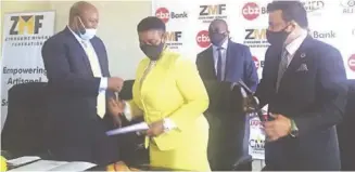  ??  ?? Mines and Mining Developmen­t Minister Winston Chitando (left) congratula­tes Zimbabwe Miners Federation president Henrietta Rushwaya (centre) and Ali Japan786 representa­tive Ali Mohammed after the signing of a co-operation agreement between the two on Friday