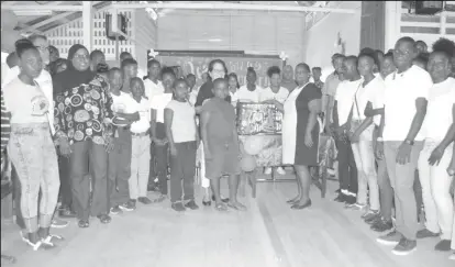  ??  ?? First Lady, Sandra Granger (centre) handing over Robotics Kits to the students and Head Teacher of Harmony Secondary School, Vernell Razack-Giles. (Ministry of the Presidency photo)