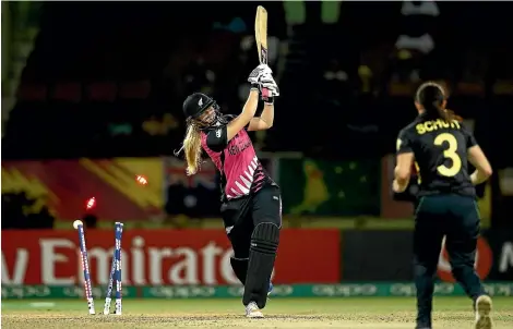  ?? GETTY IMAGES ?? Hannah Rowe swings, misses and is clean bowled as New Zealand slump to a defeat against Australia that may rule the White Ferns out of the playoffs at the T20 World Cup.