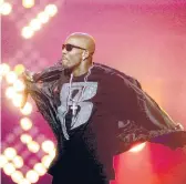  ?? DAVID GOLDMAN/AP ?? DMX, one of rap’s biggest stars of the late 1990s and early 2000s, performs in 2011 at the BET Hip Hop Awards. Born Earl Simmons, DMX died Friday at age 50.