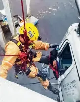  ??  ?? As 80-km/h wind gusts threatened to toss him off the truck, Justin Beazley did his best to put the truck driver at ease