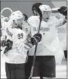  ?? AP/FRANK FRANKLIN II ?? Jan Mursak (39) celebrates with teammate Jan Urbas of Slovenia after Mursak scored the game-winning goal in Slovenia’s 3-2 overtime victory over the United States in Gangneung, South Korea.