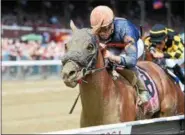  ?? NYRA FILE ?? In a July 2016 photo, Mind Your Biscuits, with Joel Rosario up, wins the Grade 2 Amsterdam Stakes at Saratoga Race Course in Saratoga Springs, N.Y.
