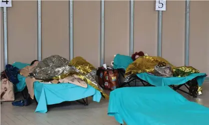  ??  ?? Patients in a temporary overflow building at Brescia hospital, Italy. ‘In Italy, the choices of whom to save and whom to allow to die are real.’ Photograph: Miguel Medina/AFP via Getty Images