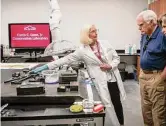  ?? ?? Conservato­r Pamela Jary Rosser shows off the new laboratory to Tony and Carolina Calanes at last week’s grand opening.