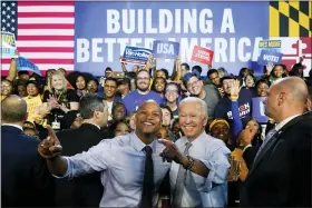  ?? SUSAN WALSH — THE ASSOCIATED PRESS ?? President Joe Biden poses for photos with Maryland Democratic gubernator­ial candidate Wes Moore during a campaign rally at Bowie State University in Bowie, Md., Monday.