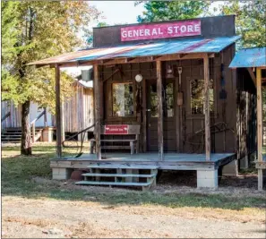  ?? WILLIAM HARVEY/THREE RIVERS EDITION ?? The general store is one of 14 buildings that Sue Griffith and her brother, Gary Griffith, have built on the Jackson Creek Homestead near Pearson. The store is stocked with replicas of canned goods and medicine bottles, as well as an antique telephone.