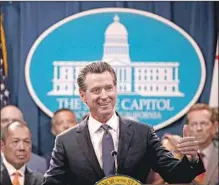  ?? Justin Sullivan Getty Images ?? THE LAW will provide worker protection­s such as minimum wage and paid sick days, Gov. Gavin Newsom said in a statement.