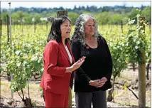  ?? JEFF CHIU / AP ?? Acting U.S. Secretary of Labor Julie Su, left, speaks next to Teresa Romero, president of the United Farm Workers, after a news conference Friday at Balletto Vineyards in Santa Rosa. Temporary farmworker­s are getting more legal protection­s against employer retaliatio­n, unsafe working conditions, illegal recruitmen­t and other abuses. The rule announced Friday by the Biden administra­tion aims to bolster support workers on H-2A visas.