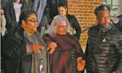  ?? STEVE HELBER ASSOCIATED PRESS ?? Susan Bro, center, mother of Heather Heyer, is escorted down the steps of the courthouse after a guilty verdict was reached in the trial of James Alex Fields Jr., who killed Heyer during the ‘Unite the Right’ rally in Charlottes­ville, Va.