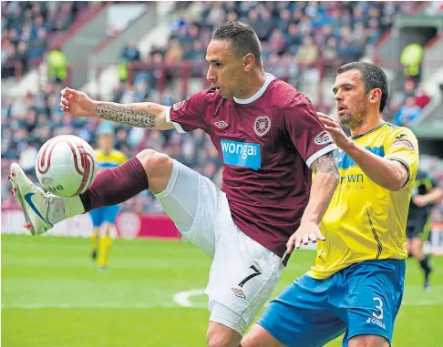  ??  ?? MIXING IT WITH THE BEST: Current Saints boss Callum Davidson playing for the Perth men against Hearts in 2012.