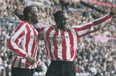  ?? ?? Dwight Yorke celebrates scoring for Sunderland with Stern John against West Bromwich Albion, back in 2007.
