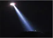  ?? Dan Watson/The Signal ?? A Los Angeles County Fire helicopter’s spotlight pinpoints an arson suspect where a small brush fire occurred at Ed Davis Park in Towsley Canyon on Wednesday.