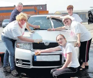  ??  ?? ●●Kath and David Gibson, Helen O’Donnell, Helen Pearson and Tanya O’Donnell washed cars to raise money for the Edinburgh Moon Walk