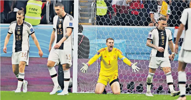  ?? ?? Down and out: Manuel Neuer yells at his defence after conceding a goal