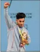  ?? PTI ?? India's Achinta Sheuli with the gold medal after winning the men's 73kg weightlift­ing category match of the Commonweal­th Games 2022 (CWG), in Birmingham, UK