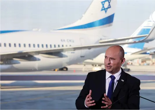  ?? (Ronen Zvulun/Reuters) ?? PRIME MINISTER Naftali Bennett delivers a statement after his tour of Ben-Gurion Airport this week amid a rise in cases of COVID-19.