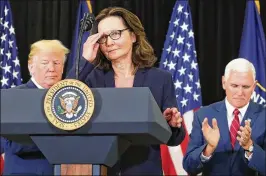  ?? MARK WILSON / GETTY IMAGES ?? New CIA Director Gina Haspel prepares to speak to her colleagues Monday at the agency’s headquarte­rs in Langley, Va. Behind her are President Donald Trump and Vice President Mike Pence, who swore Haspel in.