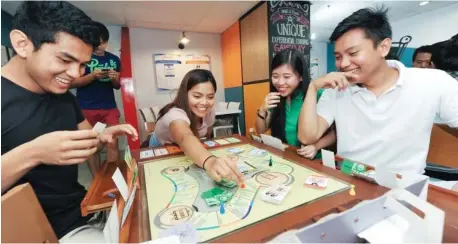  ?? (Photo provided by Praxis) ?? FINANCIAL LITERACY THE FUN, EASY WAY. The Praxis Gameplay teaches about matters related to personal finance in a safe, low risk and fun environmen­t. The game puts players in senarios they are likely to encounter when engaged in actual business.