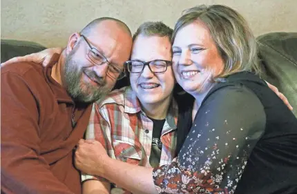  ?? RICK BOWMER/AP ?? Robyn and Clay Rumsey’s child Dex, 15, of Roy, Utah, came out as transgende­r at age 12. In consultati­on with a counselor and doctors, he used puberty blockers and testostero­ne. He says he could become depressed and suicidal if a ban on hormone therapy and sex-reassignme­nt surgery for minors passes.