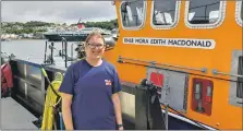  ?? ?? Right: Donna Fryer finished her 100k run, which is raising funds for for the RNLI, at Oban lifeboat station.