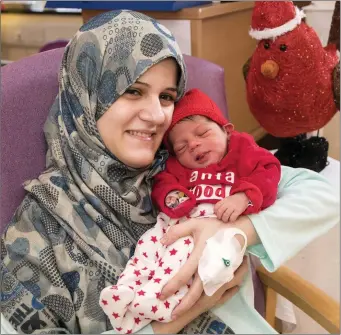  ??  ?? Rawan Aimeshael from Hollyview Heights, Wexford, with Mohamed, the first baby born at Wexford Hospital on Christmas Day.